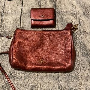 Coach shimmery maroon cross body with matching wallet